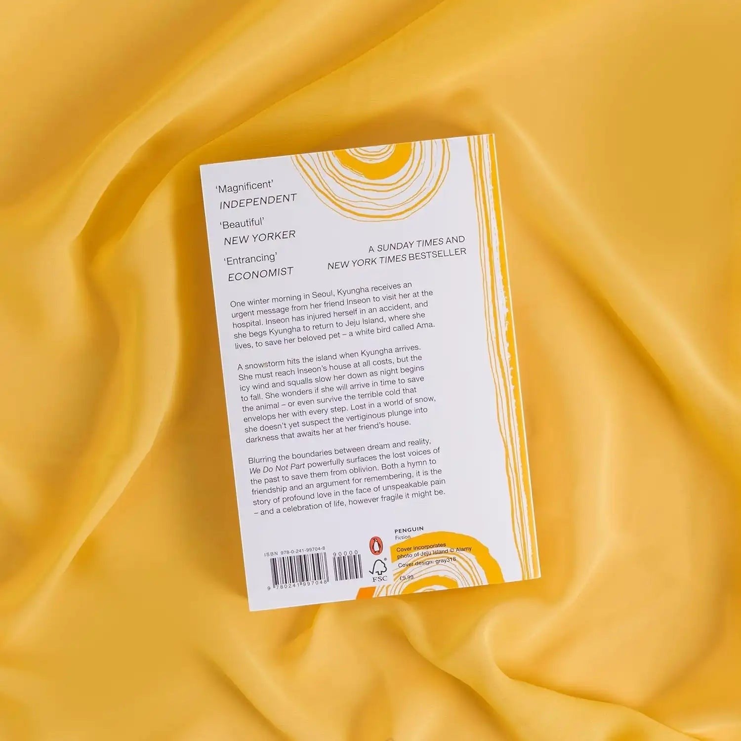 Back cover of We Do Not Part by Han Kang, a Books and You paperback novel with yellow fabric background.
